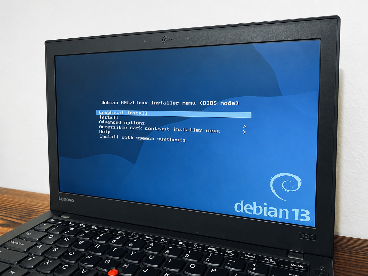 The Debian installer menu during the rebuild process.